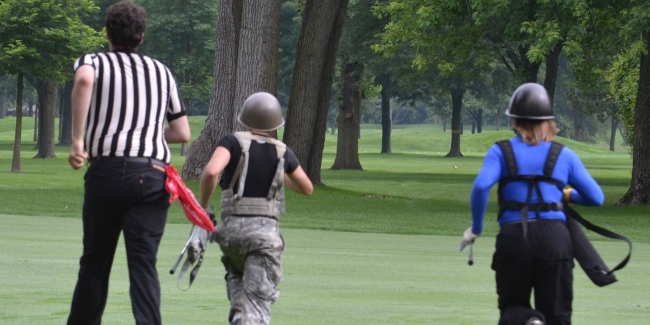 Referee Joe Hamid (left), Nick Caramagno and Paul Lubanski sprint to the next Wilderness Golf shot on Dearborn Country Clubs 16th hole.